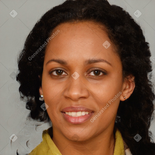 Joyful black young-adult female with medium  brown hair and brown eyes