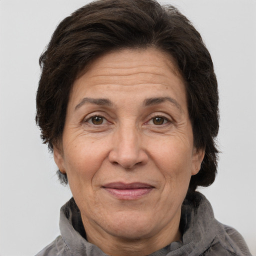 Joyful white middle-aged female with short  brown hair and brown eyes