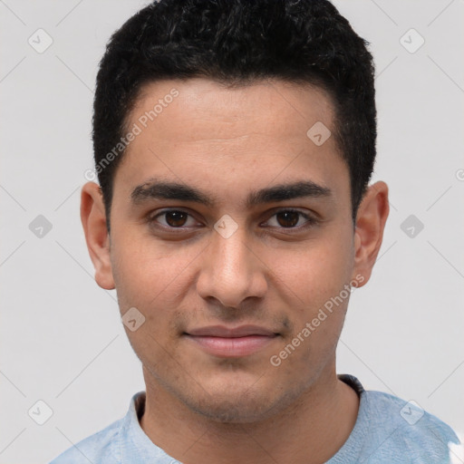 Joyful white young-adult male with short  black hair and brown eyes