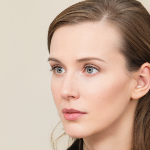 Neutral white young-adult female with long  brown hair and grey eyes