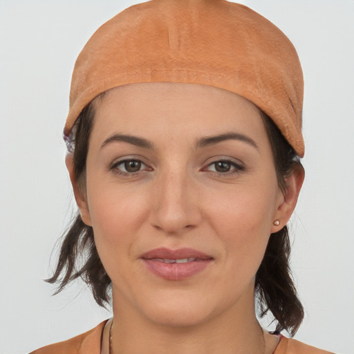 Joyful white young-adult female with medium  brown hair and brown eyes