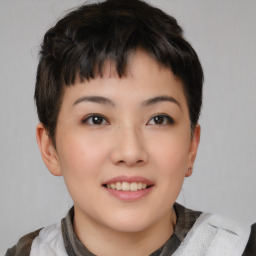 Joyful asian young-adult female with short  brown hair and brown eyes