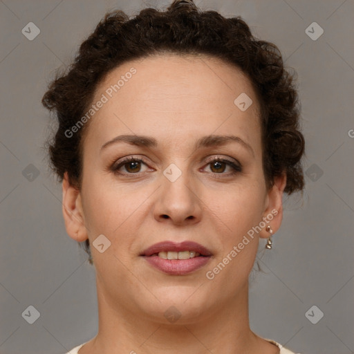 Joyful white adult female with short  brown hair and brown eyes