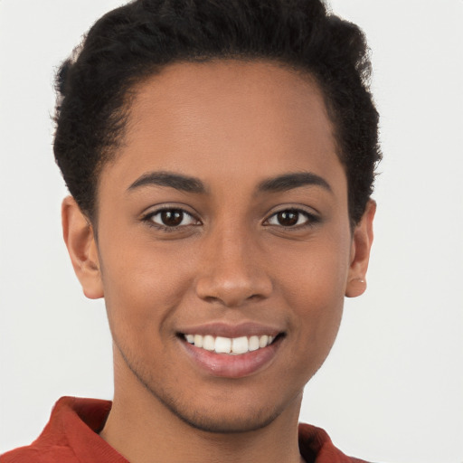 Joyful latino young-adult female with short  brown hair and brown eyes