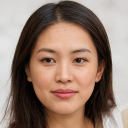 Joyful asian young-adult female with long  brown hair and brown eyes