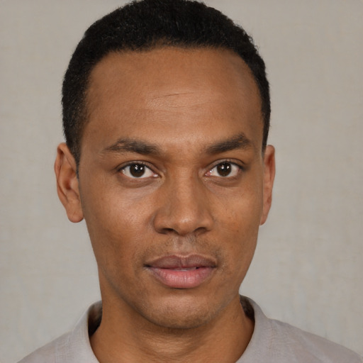 Neutral black young-adult male with short  black hair and brown eyes