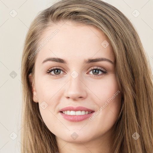 Joyful white young-adult female with long  brown hair and green eyes