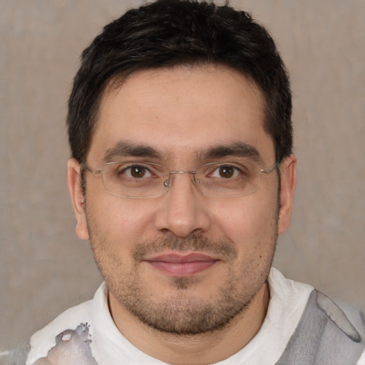 Joyful white adult male with short  brown hair and brown eyes