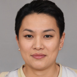 Joyful asian young-adult female with short  black hair and brown eyes