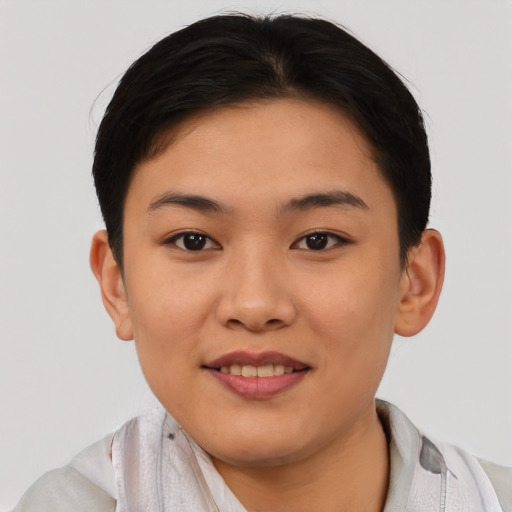 Joyful asian young-adult female with short  black hair and brown eyes