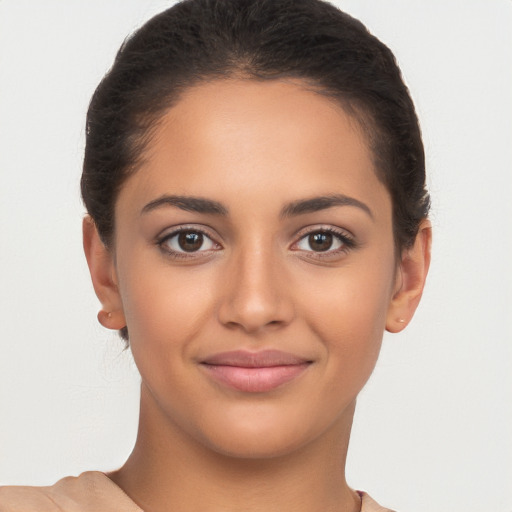 Joyful latino young-adult female with short  brown hair and brown eyes