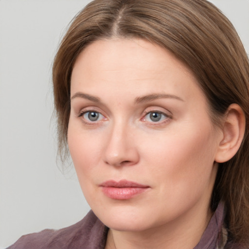 Neutral white young-adult female with long  brown hair and blue eyes