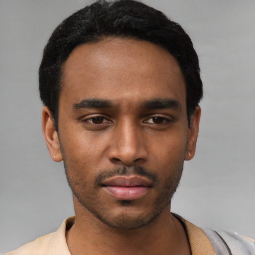Neutral black young-adult male with short  black hair and brown eyes