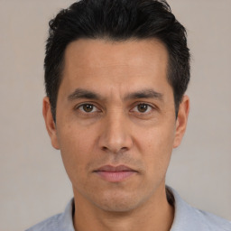 Neutral white adult male with short  black hair and brown eyes