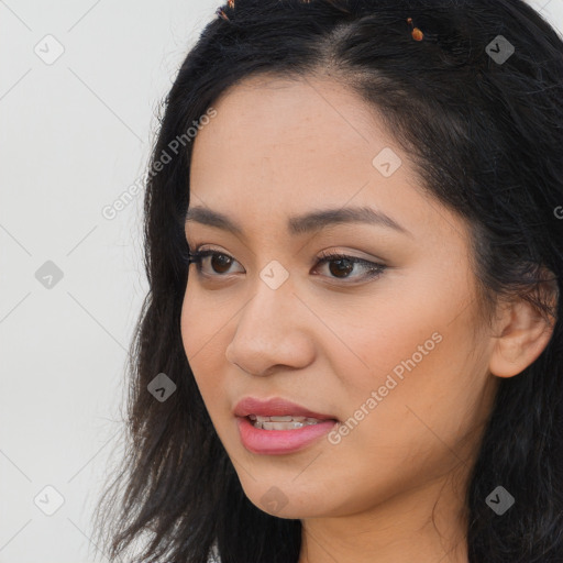 Joyful latino young-adult female with long  brown hair and brown eyes