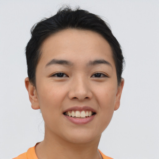 Joyful asian young-adult female with short  brown hair and brown eyes