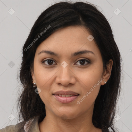 Joyful latino young-adult female with medium  brown hair and brown eyes