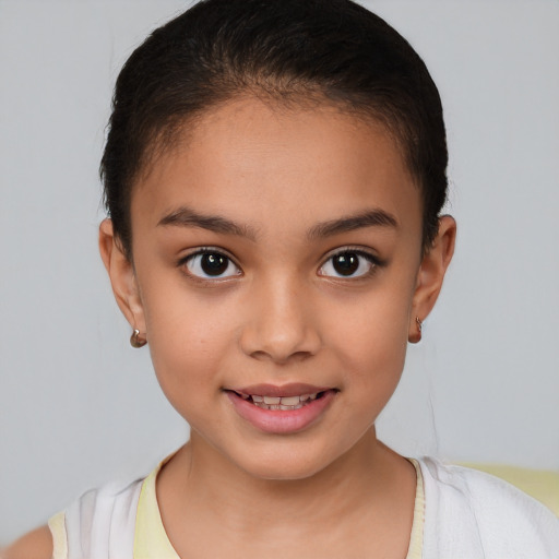 Joyful white child female with short  brown hair and brown eyes