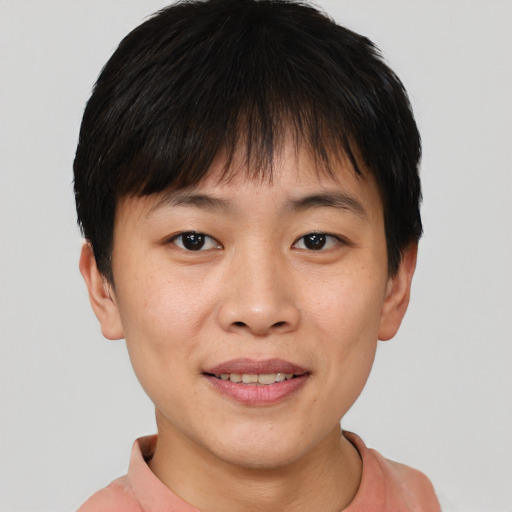 Joyful asian young-adult female with short  brown hair and brown eyes
