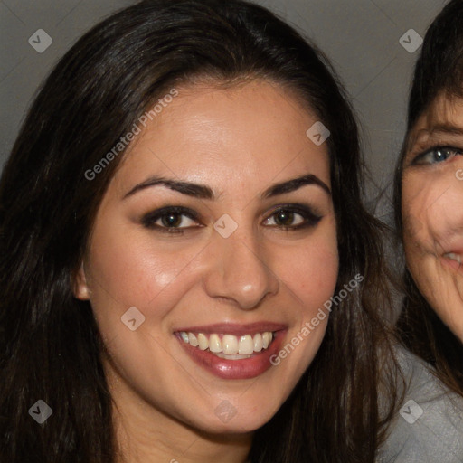 Joyful white adult female with long  brown hair and brown eyes