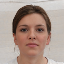 Neutral white young-adult female with short  brown hair and brown eyes