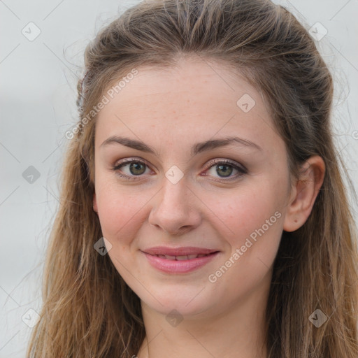 Joyful white young-adult female with long  brown hair and grey eyes