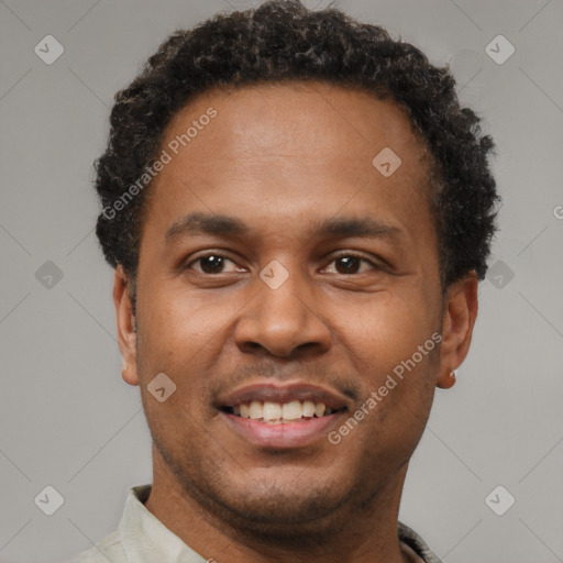 Joyful latino young-adult male with short  brown hair and brown eyes