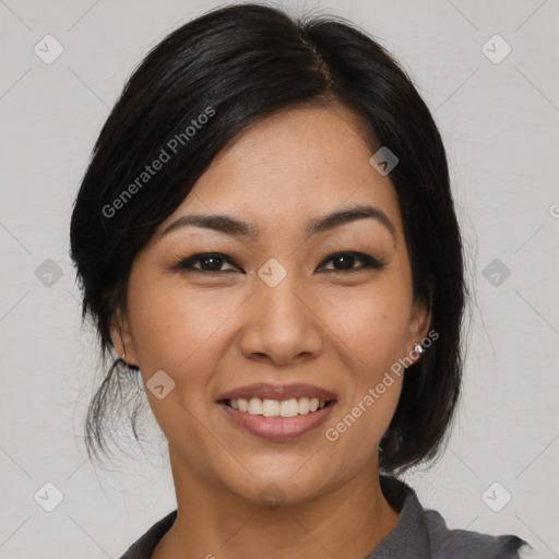 Joyful asian young-adult female with medium  black hair and brown eyes