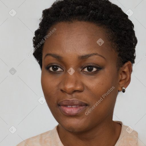 Joyful black young-adult female with short  black hair and brown eyes