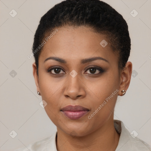 Joyful black young-adult female with short  black hair and brown eyes