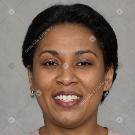 Joyful latino adult female with short  brown hair and brown eyes