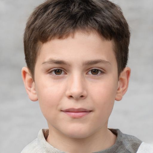 Joyful white child male with short  brown hair and brown eyes