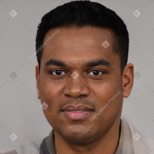 Joyful black young-adult male with short  black hair and brown eyes