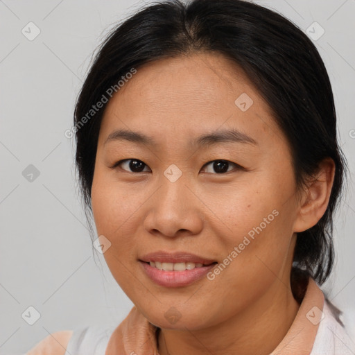 Joyful asian young-adult female with medium  brown hair and brown eyes