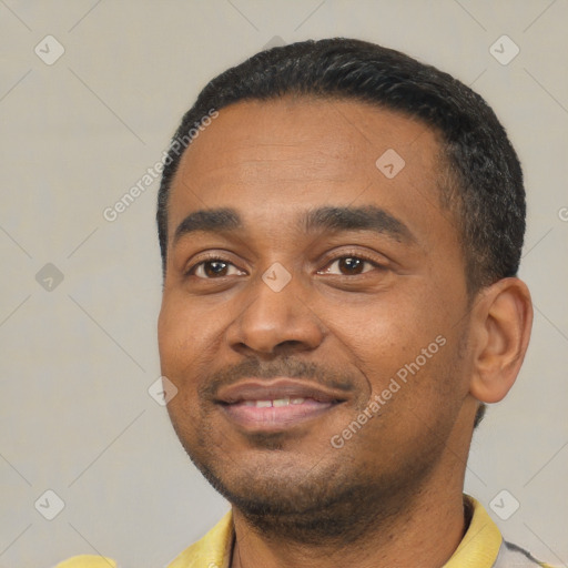 Joyful latino young-adult male with short  black hair and brown eyes