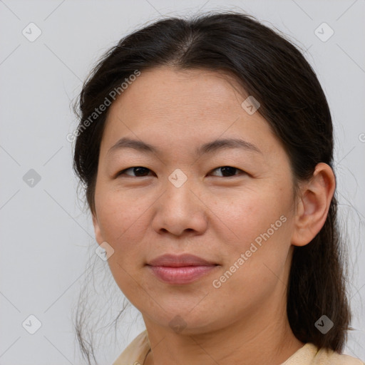 Joyful white adult female with medium  brown hair and brown eyes