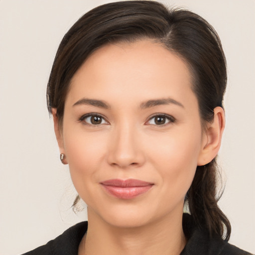 Joyful white young-adult female with medium  brown hair and brown eyes