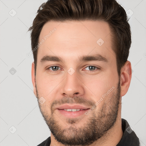 Joyful white young-adult male with short  brown hair and brown eyes