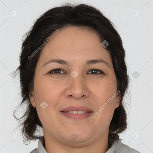 Joyful white adult female with medium  brown hair and brown eyes