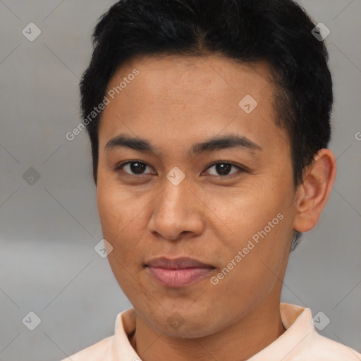 Joyful asian young-adult male with short  black hair and brown eyes