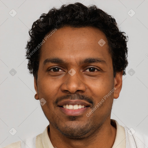 Joyful black young-adult male with short  black hair and brown eyes