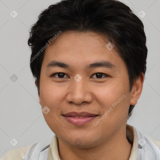 Joyful asian young-adult male with short  brown hair and brown eyes