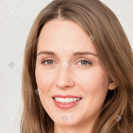 Joyful white young-adult female with long  brown hair and green eyes