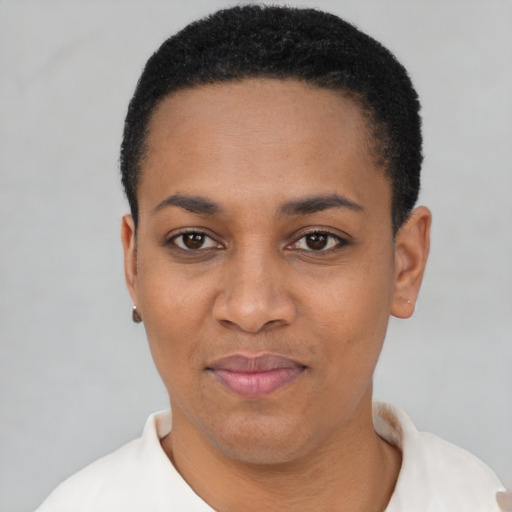 Joyful latino young-adult female with short  black hair and brown eyes