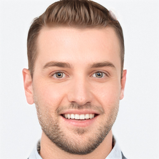 Joyful white young-adult male with short  brown hair and grey eyes