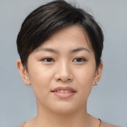 Joyful asian young-adult female with short  brown hair and brown eyes