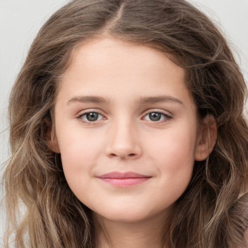 Joyful white child female with long  brown hair and grey eyes