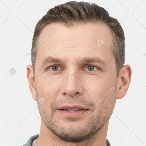 Joyful white adult male with short  brown hair and brown eyes