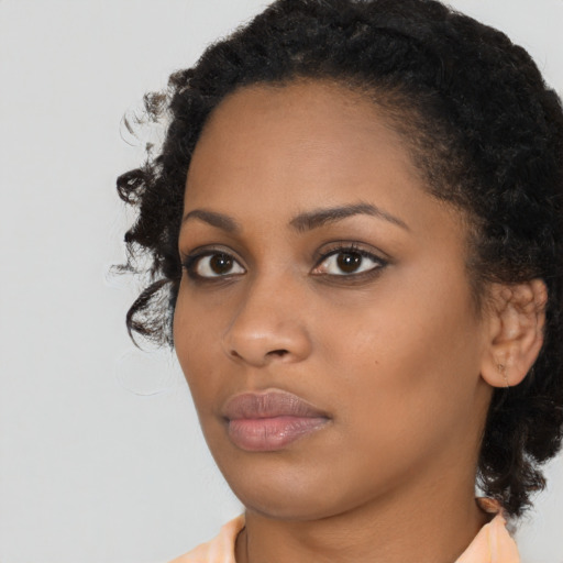 Neutral black young-adult female with medium  black hair and brown eyes