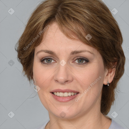 Joyful white adult female with medium  brown hair and blue eyes